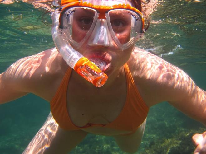 A woman snorkeling.