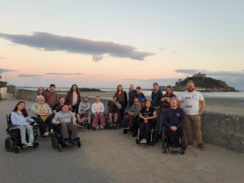 group stood in front of St Michael's Mount at dusk